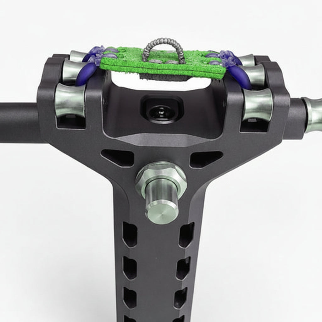 Close-up of a motorcycle handlebar riser with green grip pad and purple accents on a white background.