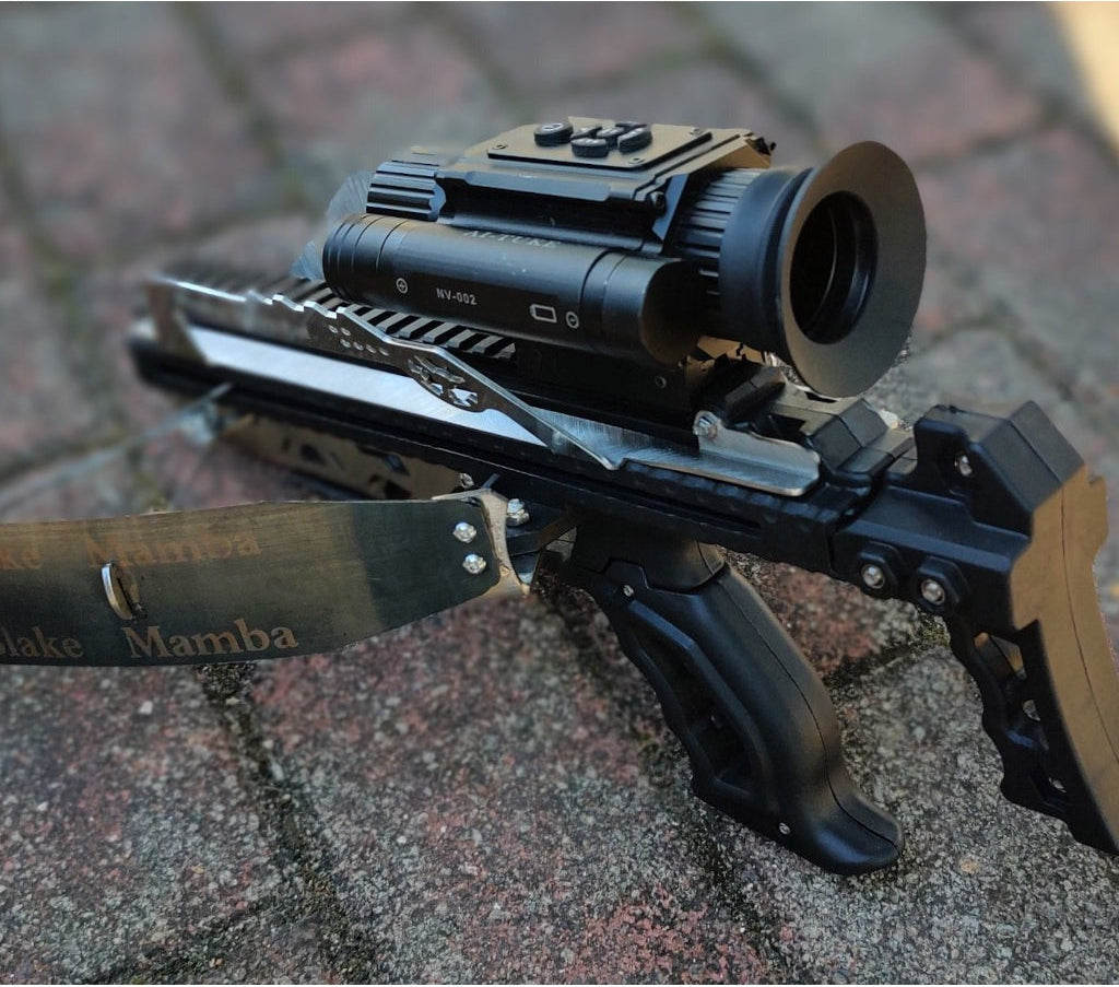 Weapon with a scope and knife on a textured surface, featuring 'Survival' branding.